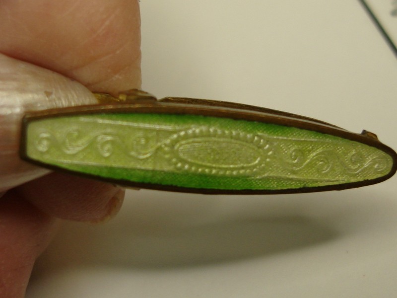 Antique Art Deco lingerie clip made of gold-washed brass and green guilloche enamel