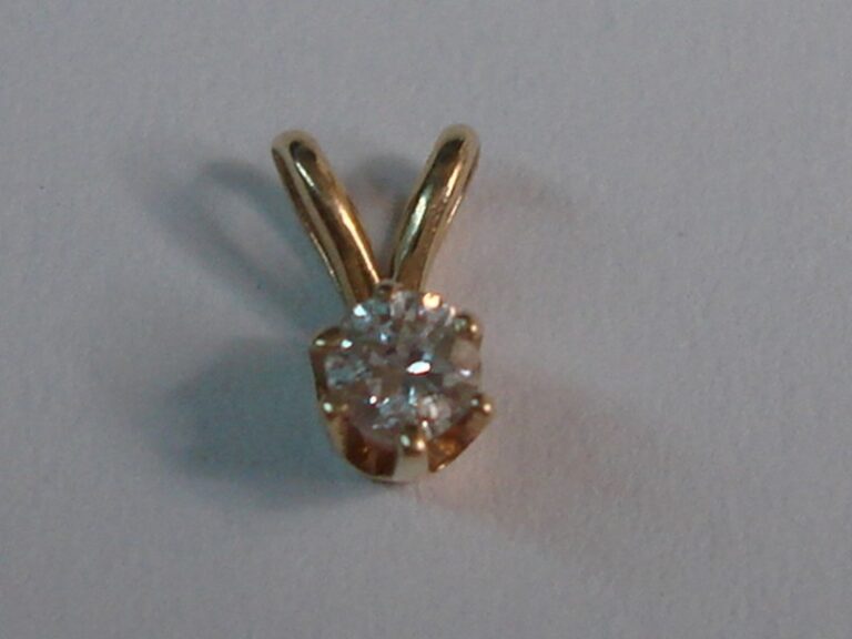 14K gold diamond pendant with a sparkling 0.05 carat diamond.