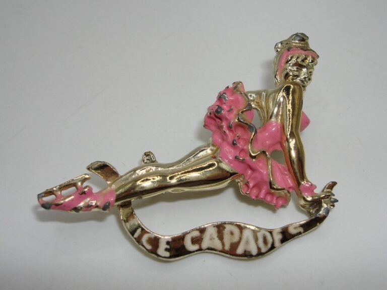 Vintage 1960s Ice Capades pin featuring a gold-tone ice skater