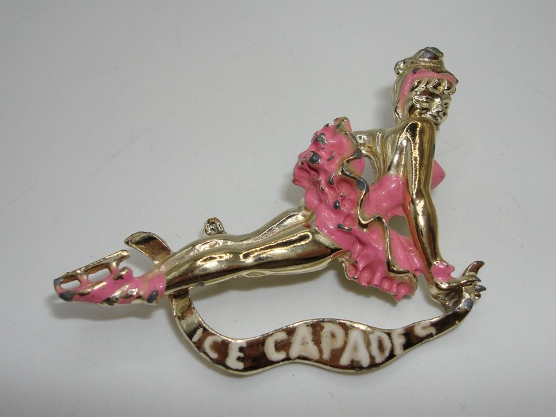 Vintage 1960s Ice Capades pin featuring a gold-tone ice skater
