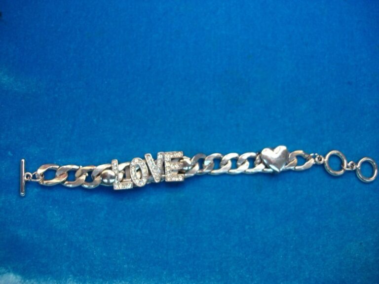 Heavy silver-tone 'LOVE' bracelet with floating heart pendant