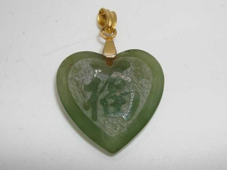 Vintage green jade heart pendant carved with a love symbol