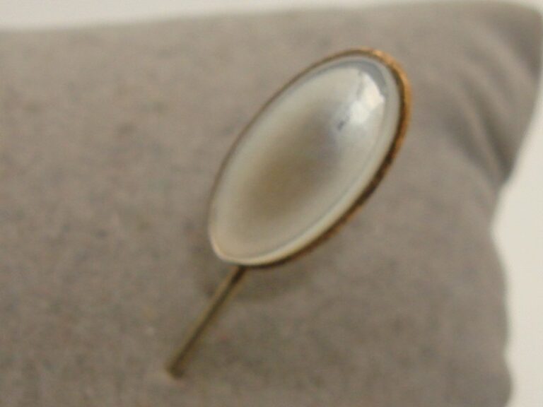 Antique gold-tone stick pin with iridescent mother-of-pearl cabochon
