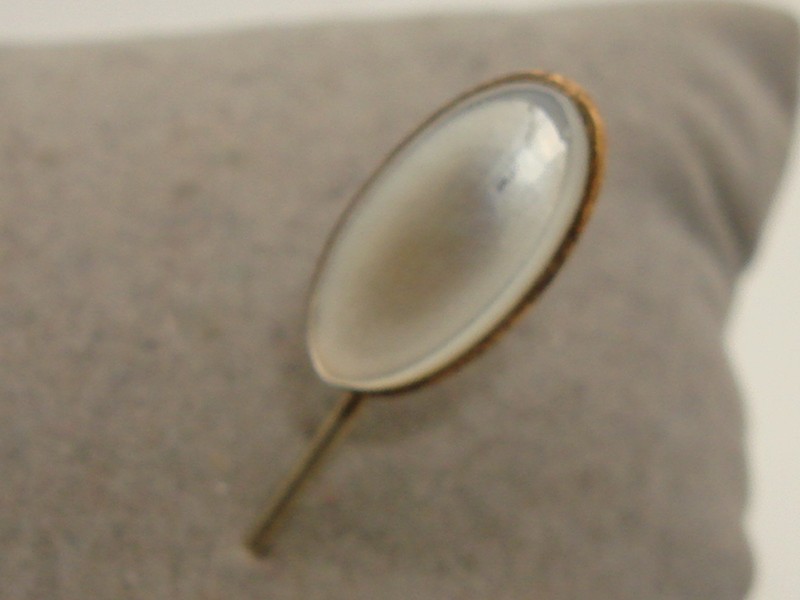 Antique gold-tone stick pin with iridescent mother-of-pearl cabochon