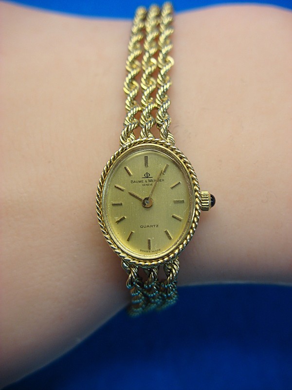 Vintage Baume & Mercier 14K gold ladies watch with a triple rope chain bracelet, awarded for 25 years of service in 1984.