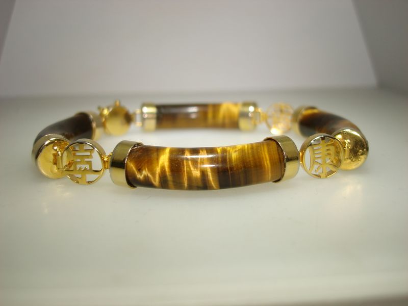 Vintage gold-plated tiger eye bracelet with Oriental design, 1960s-70s