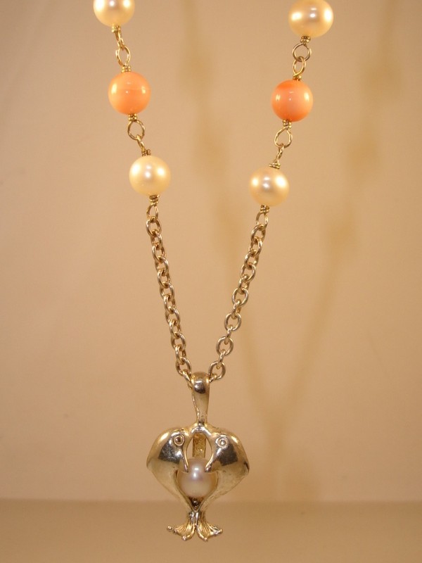 Sterling silver dolphin cage necklace with freshwater pearl and coral accents