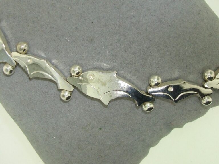 Solid sterling silver dolphin bracelet with exquisite detail and craftsmanship
