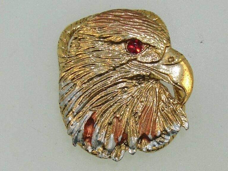 Gold-tone Apache eagle head scarf slide or bolo with enamel trim