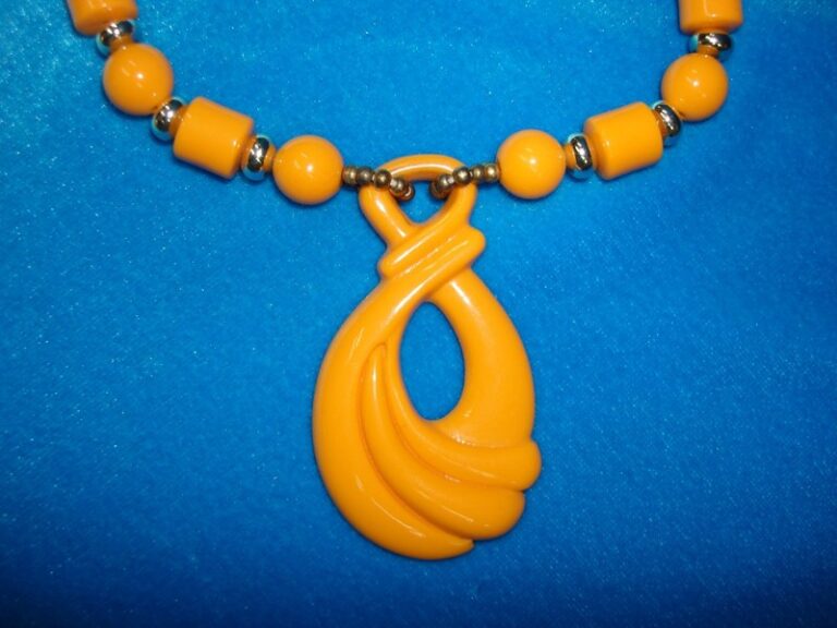 Vintage 1960s orange lucite pendant necklace with beads