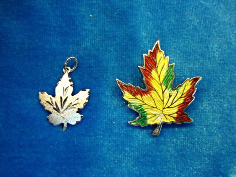 Sterling silver maple leaf pendant and pin set with enamel detailing