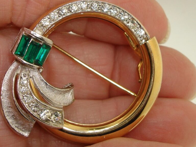 Vintage gold tone circle pin with hidden rhinestone surprise