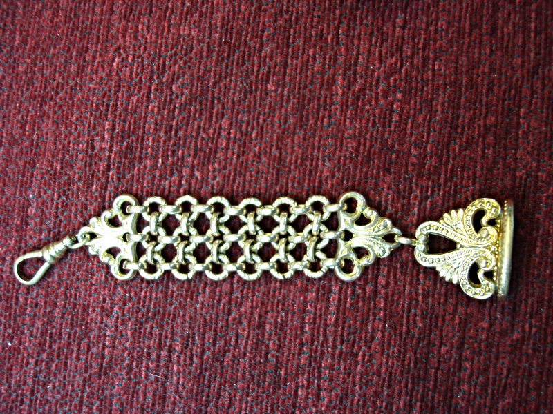 Antique gold-filled wax sealer watch chain with intricate detailing