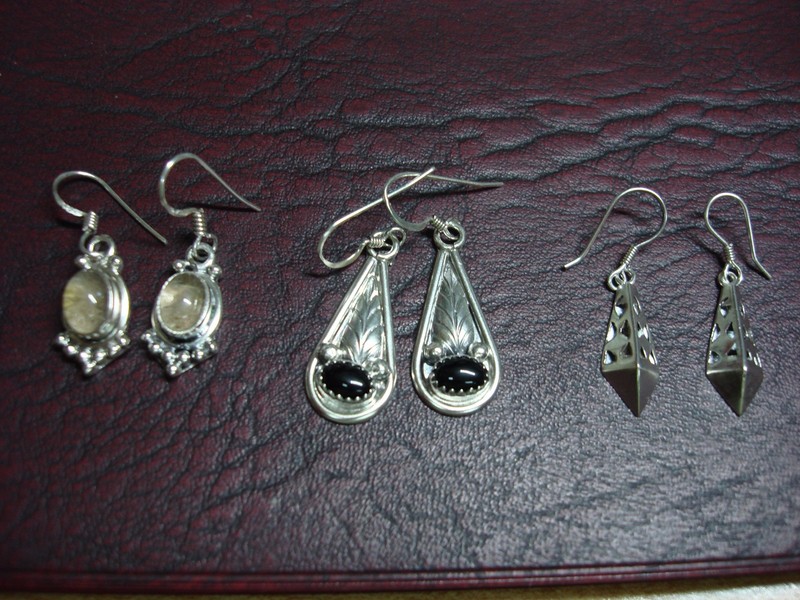 Three sets of sterling silver dangle earrings with onyx and stones