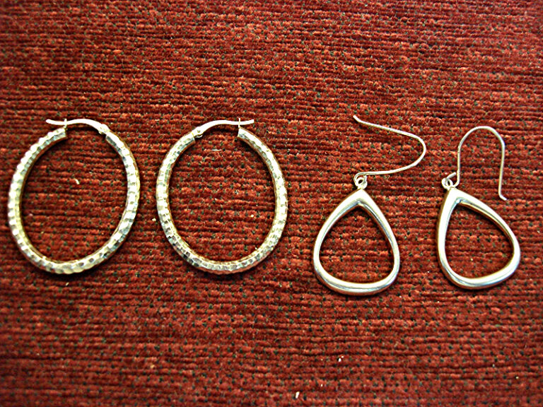 Two pairs of pre-owned sterling silver earrings with unique high style designs