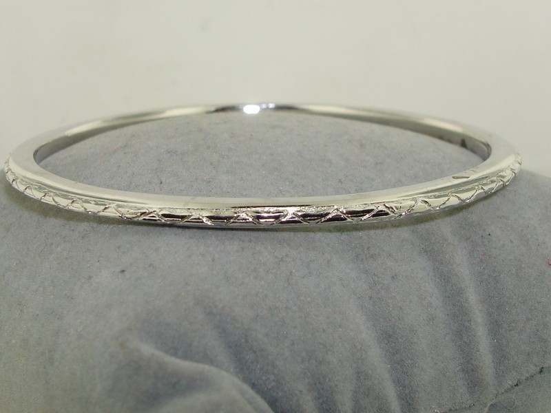Vintage Crown Trifari etched silver-tone bangle bracelet, 1950s-60s
