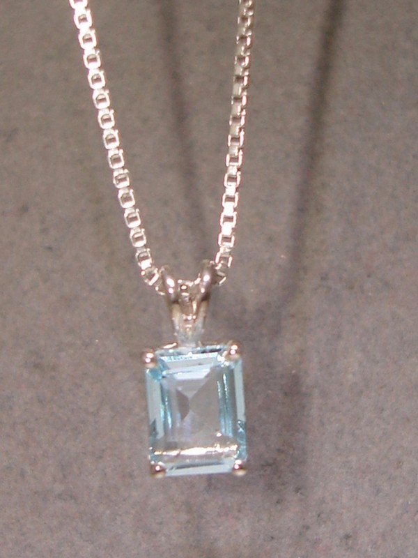 Sterling silver necklace with blue topaz pendant