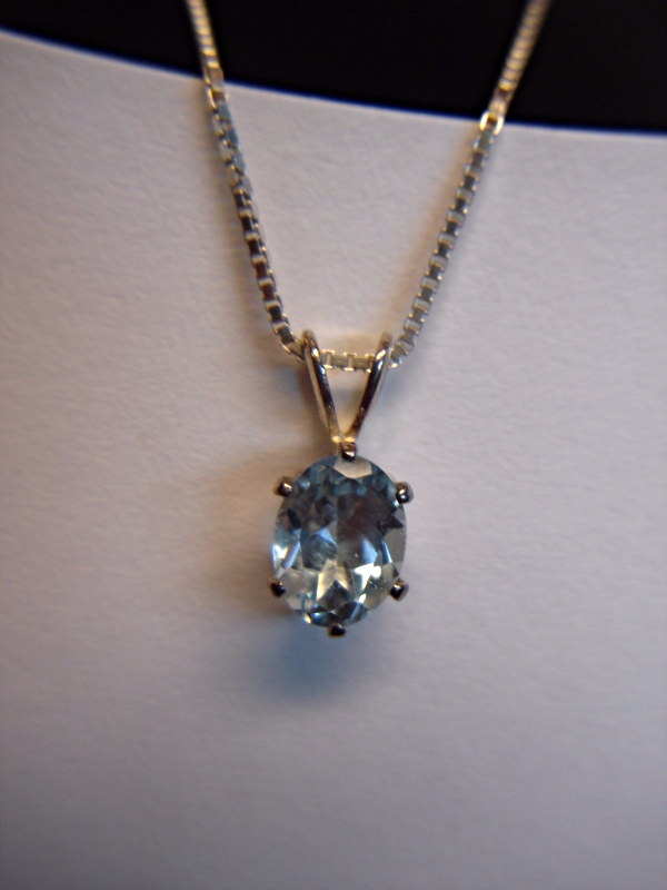 Oval cut blue topaz pendant in sterling silver with 18 inch chain