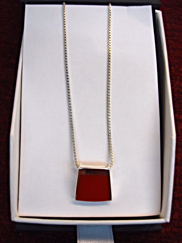 Sterling silver pendant with simulated red coral and 18-inch box chain
