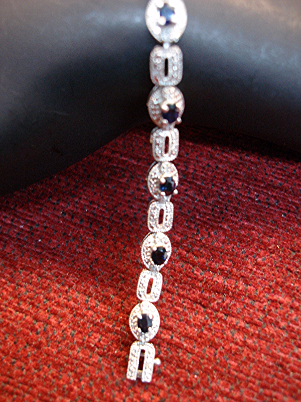 Sterling silver bracelet with blue topaz and diamond accents