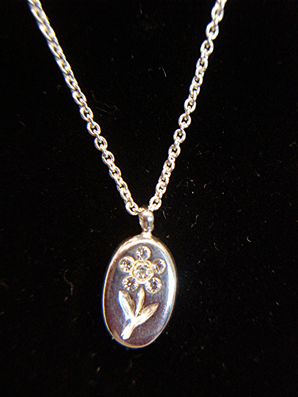 Sterling silver flower pendant with cubic zirconia stones