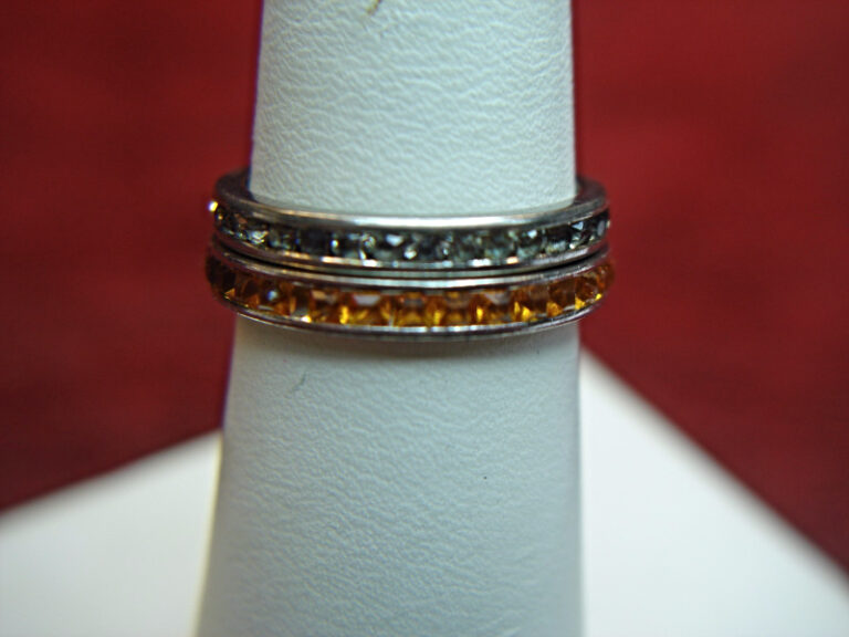 Sterling silver ring set with amber and clear stones