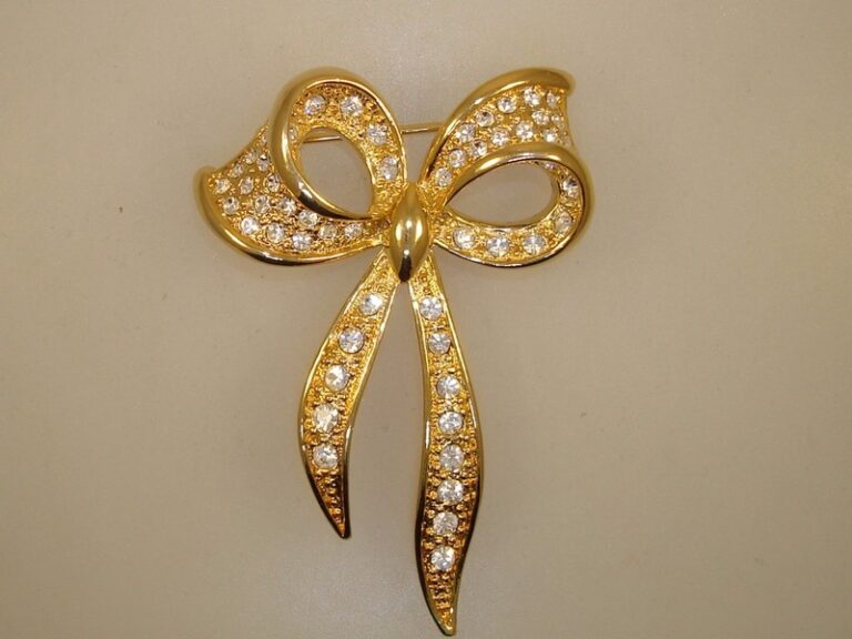Vintage Napier gold-tone rhinestone bow brooch pin
