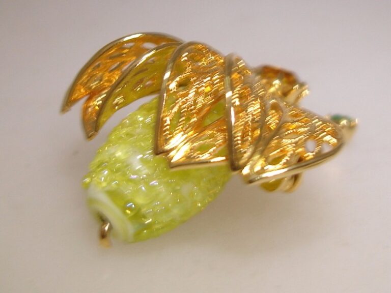 Vintage gold-tone filigree hand-blown glass bug pin with green sparkling rhinestones