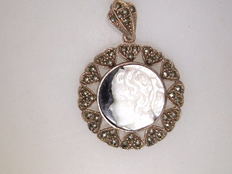 Vintage sterling silver marcasite and MOP cameo pendant on onyx