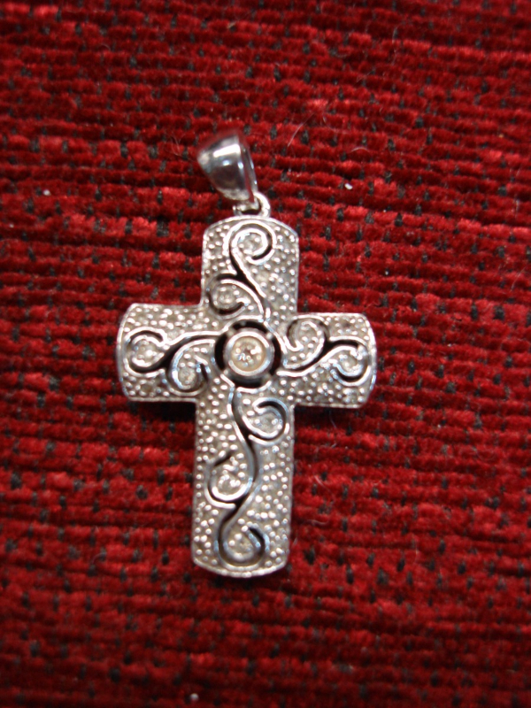 Sterling silver cross with fancywork and diamond accents