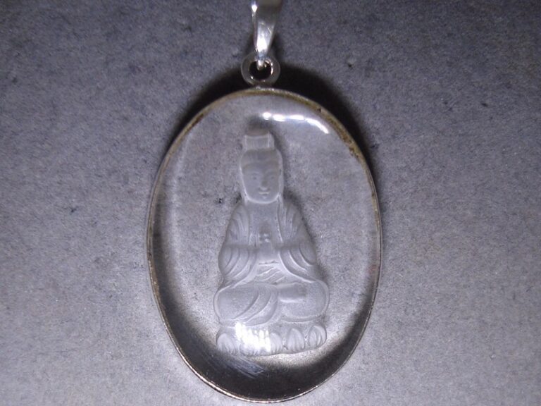 Sterling silver pendant with a reverse-carved crystal Buddha