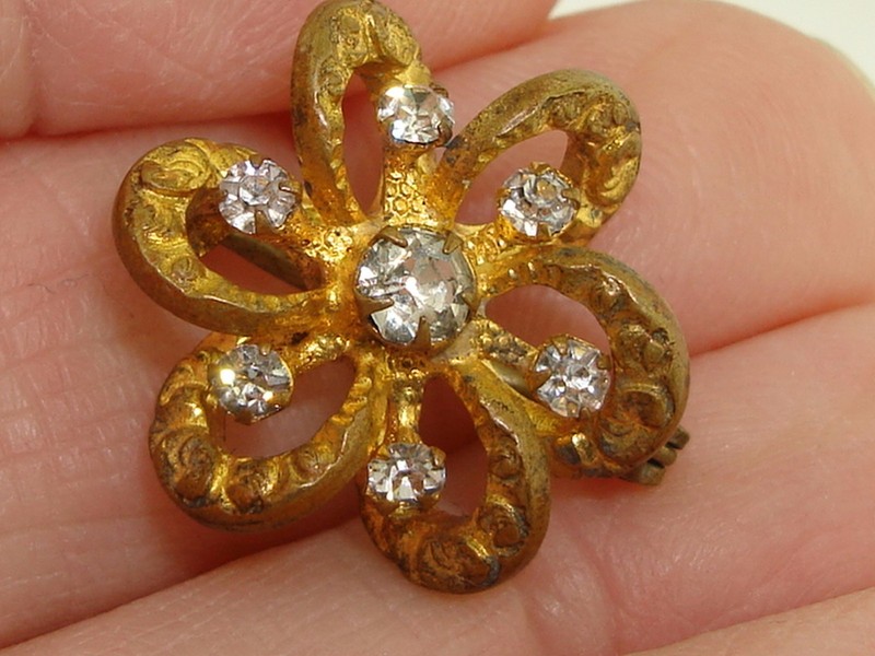 Victorian gold-washed repousse lover's knot pin with sparkling paste stones