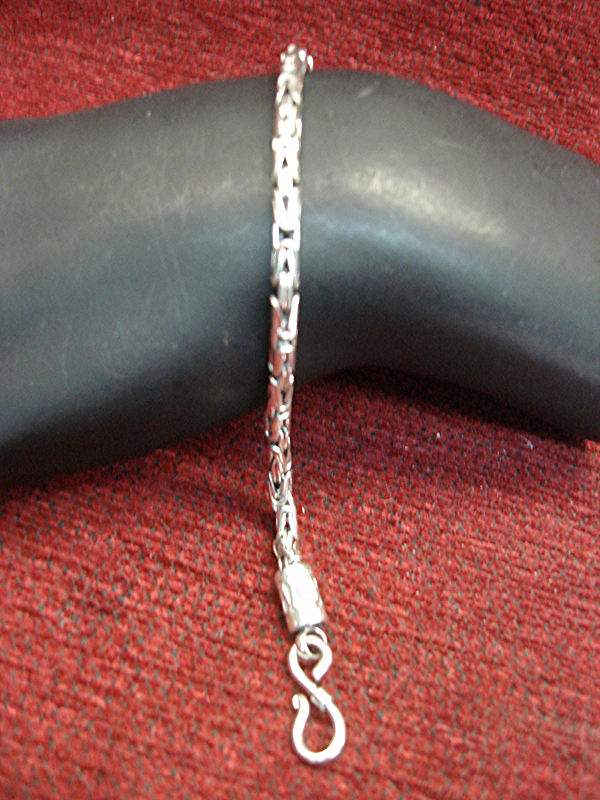 Sterling silver link bracelet with fancy design and S-hook closure