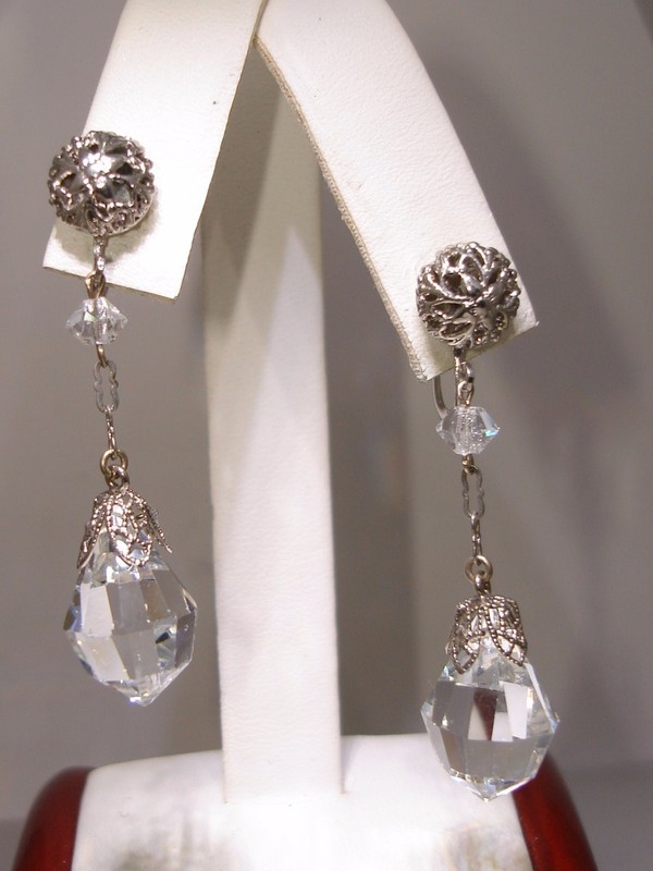 Vintage 1940s silver filigree dangle earrings with faceted glass briolettes.