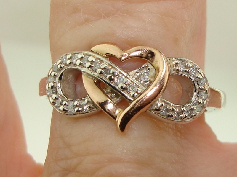 Sterling silver and gold-plated heart ring with 1/5 carat diamond accents