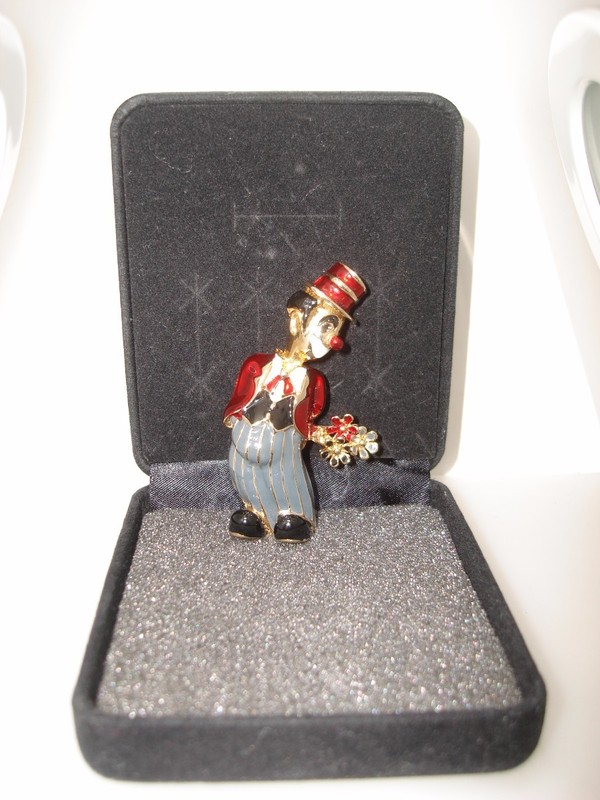Vintage enamel clown pin with gray, black, and red enamel details
