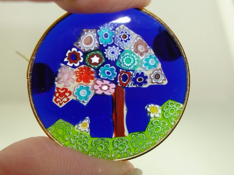 Authentic Murrina Veneziana Millefiori glass pin with cobalt blue background and gold-plated sterling silver frame.