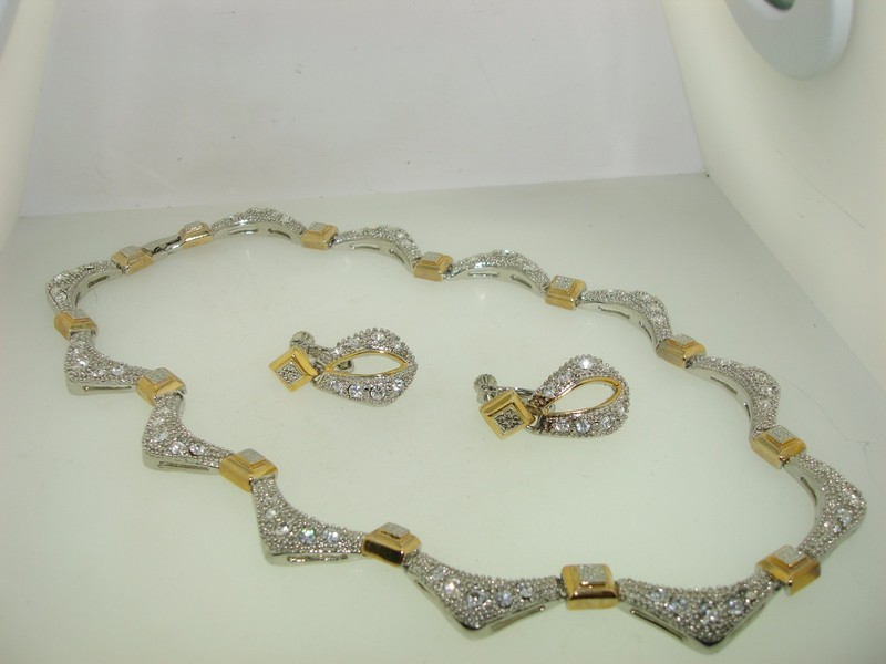 Sparkling silver and gold tone CZ necklace and dangle earring set