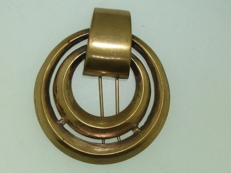 Vintage 1920s-30s Coro Art Deco brass fur clip with 'No Angle Script'