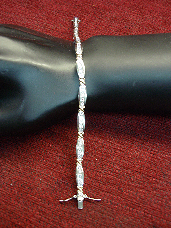 Sparkling sterling silver bracelet with gold vermeil links and cubic zirconia stones