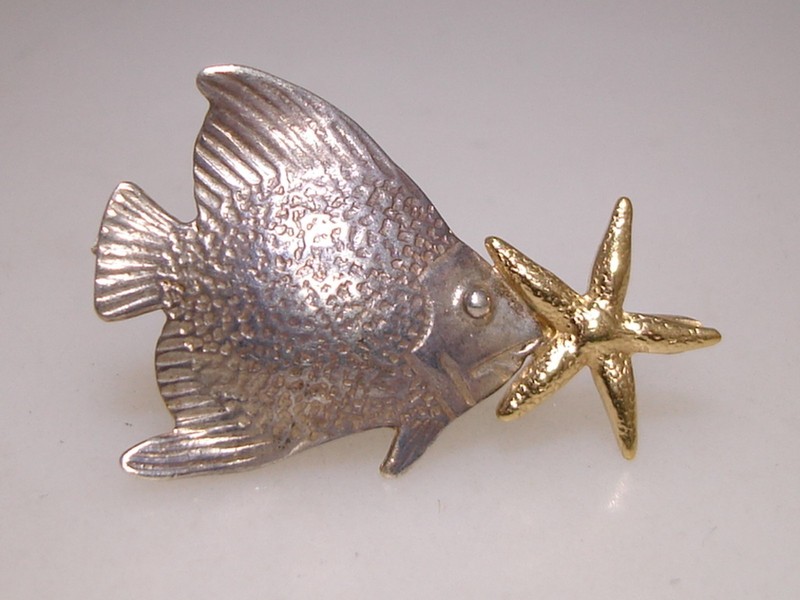 Signed Courtney Peterson sterling silver and gold-plated fish slide with a starfish accent