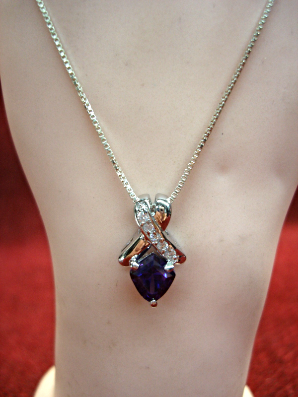 Sterling silver chain and purple stone pendant with simulated diamonds