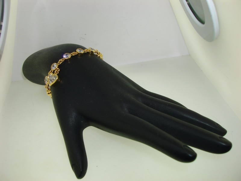 Gold-plated sterling silver heart toggle bracelet with cubic zirconia stones