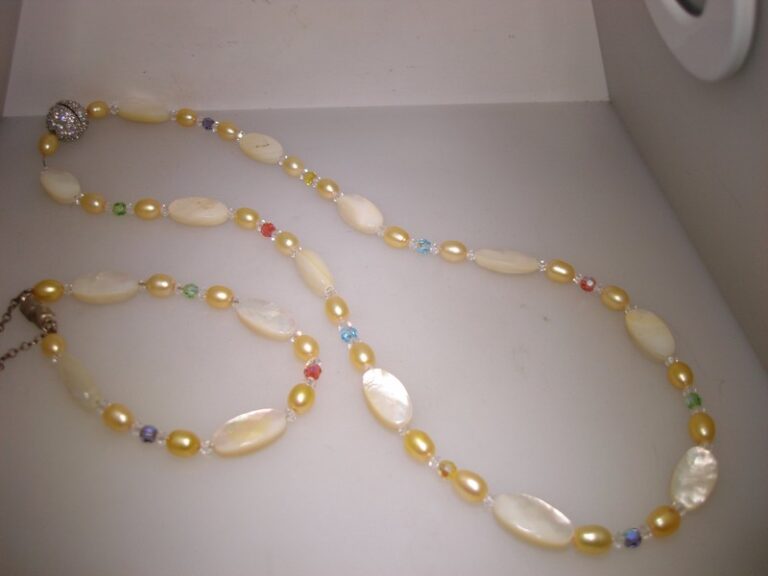 Vintage gold-tone necklace and bracelet set with mother-of-pearl, freshwater pearls, and aurora borealis crystals