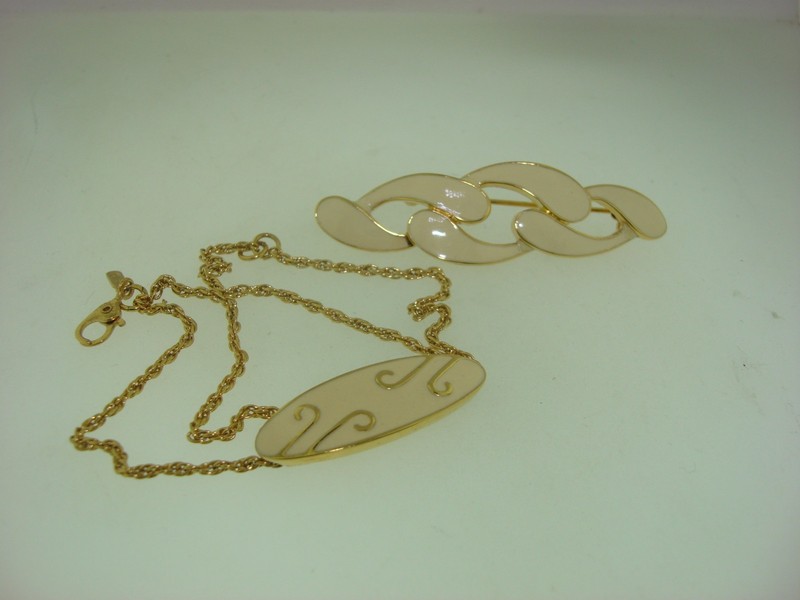 Vintage Monet gold tone enamel pin and bracelet set from the 1960s-70s