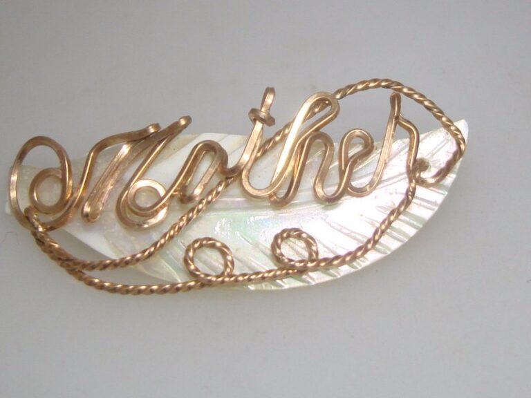 Vintage mother of pearl feather pin with rose gold 'MOTHER' inscription