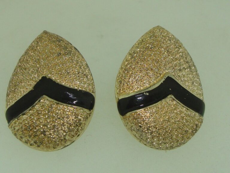 Vintage 1960s Coro clip-on earrings, textured gold tone with black enamel.