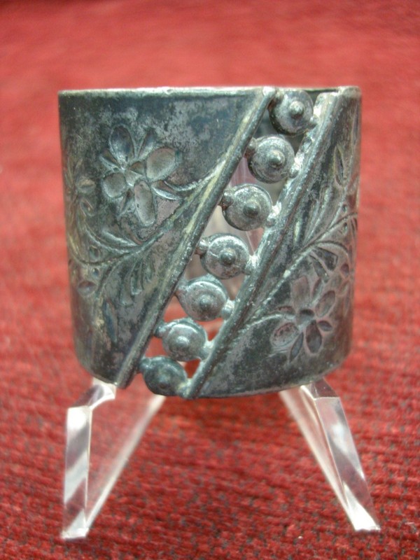 Antique pewter napkin ring with vintage floral design