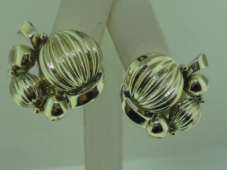 Vintage 1950s Coro gold-tone clip-on earrings with smooth and ridged half balls.