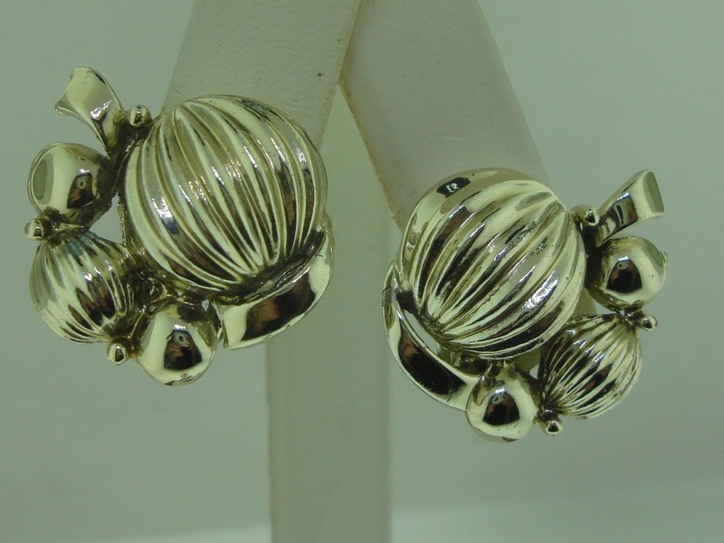 Vintage 1950s Coro gold-tone clip-on earrings with smooth and ridged half balls.